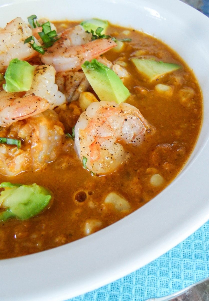 Smokey corn chowder with shrimp and avocado on top.