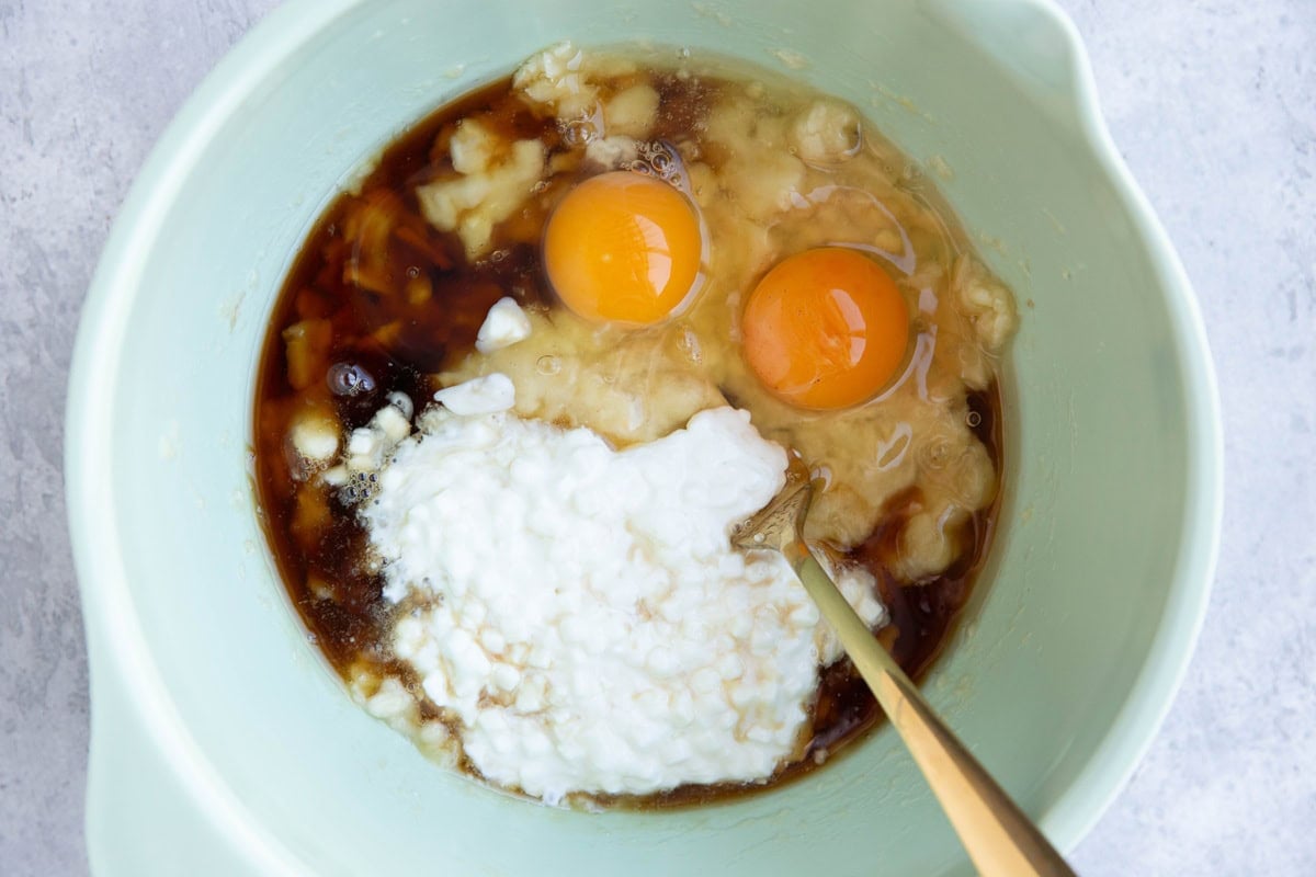 Wet ingredients for breakfast cake in a mixing bowl.