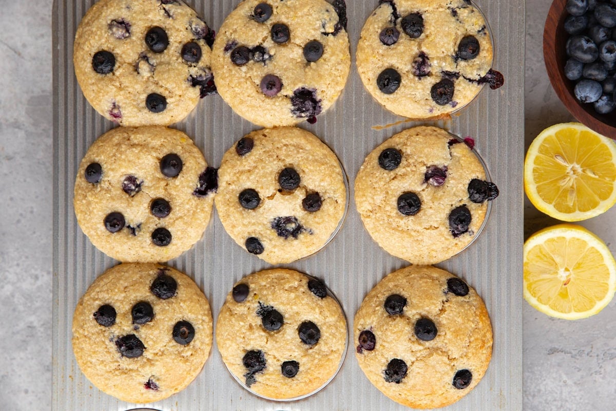 Muffin tray with cottage cheese muffins, fresh out of the oven.