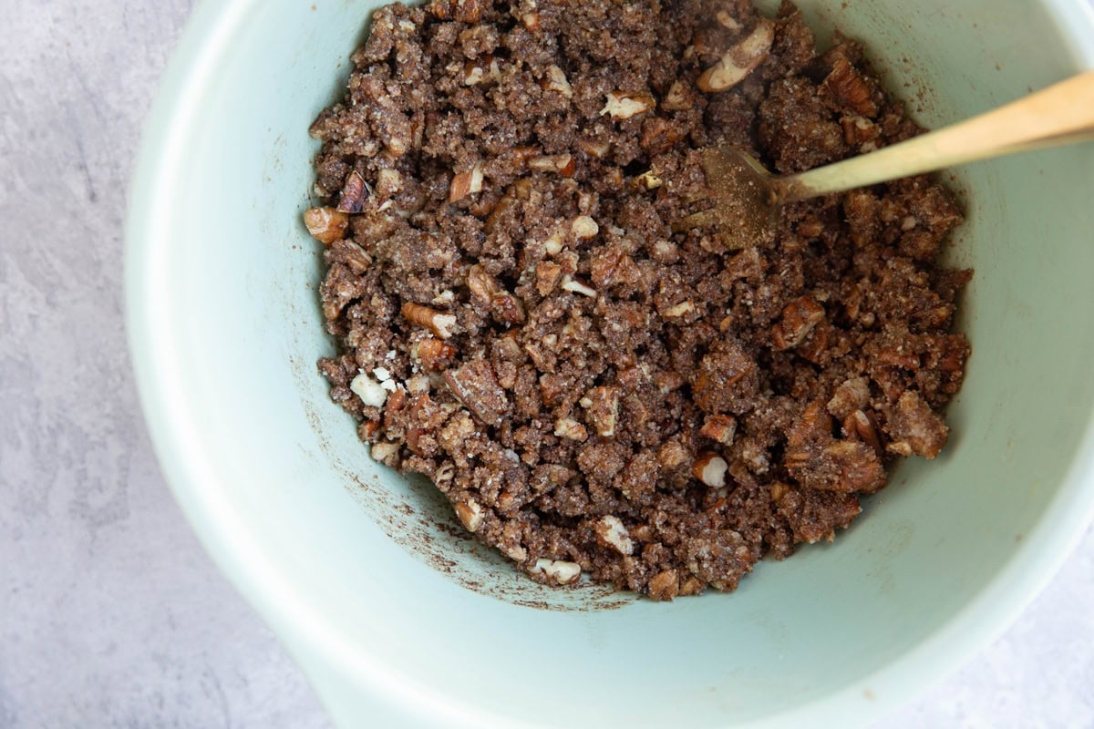 Mixing bowl with pecan cinnamon swirl mixture for cinnamon rolls.
