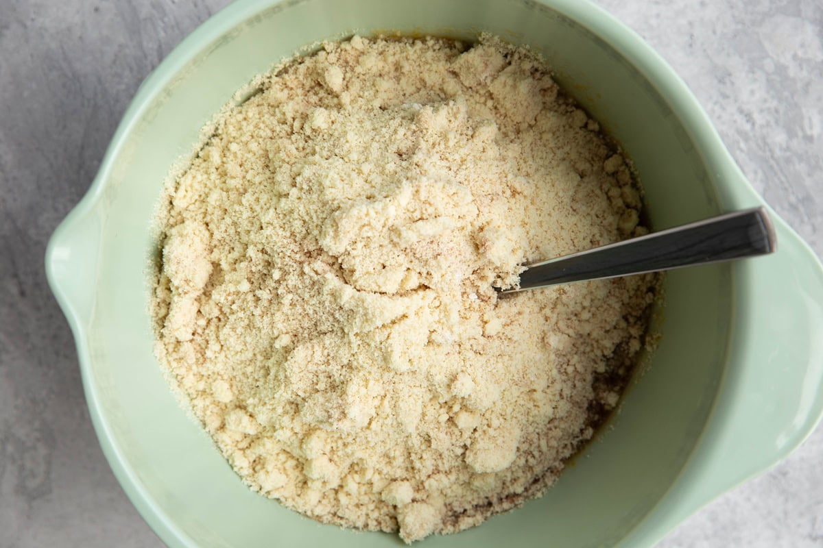 Dry ingredients on top of wet ingredients in a mixing bowl.