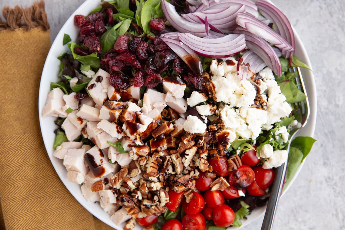 Large bowl full of spring green salad.