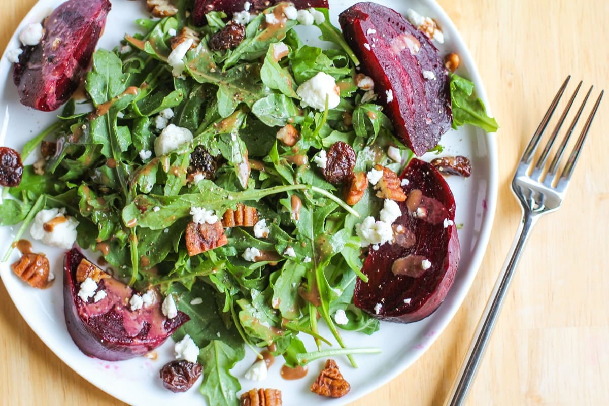 Roasted beets with fresh arugula drizzled with balsamic dressing and sprinkled with goat cheese, dried cranberries, and pecans.