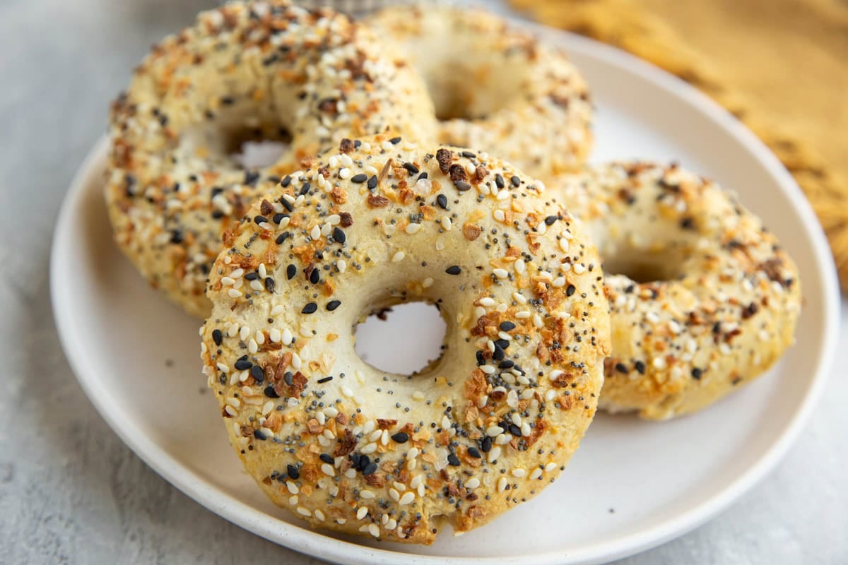 Plate of homemade everything bagels, ready to eat.