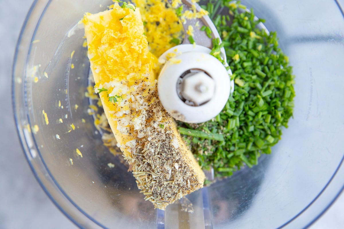 Compound butter ingredients in a food processor.