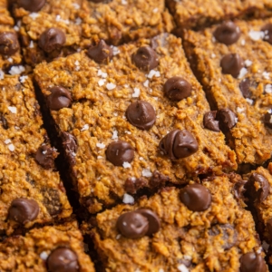 Sweet potato oatmeal bars with chocolate chips and sea salt cut into individual bars.
