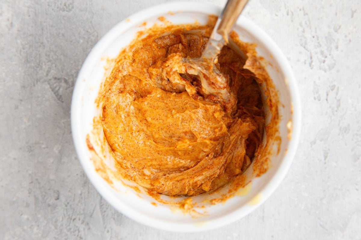 Garlic, butter, paprika, onion powder, and sea salt mixed together in a small bowl to spread over a turkey roast.