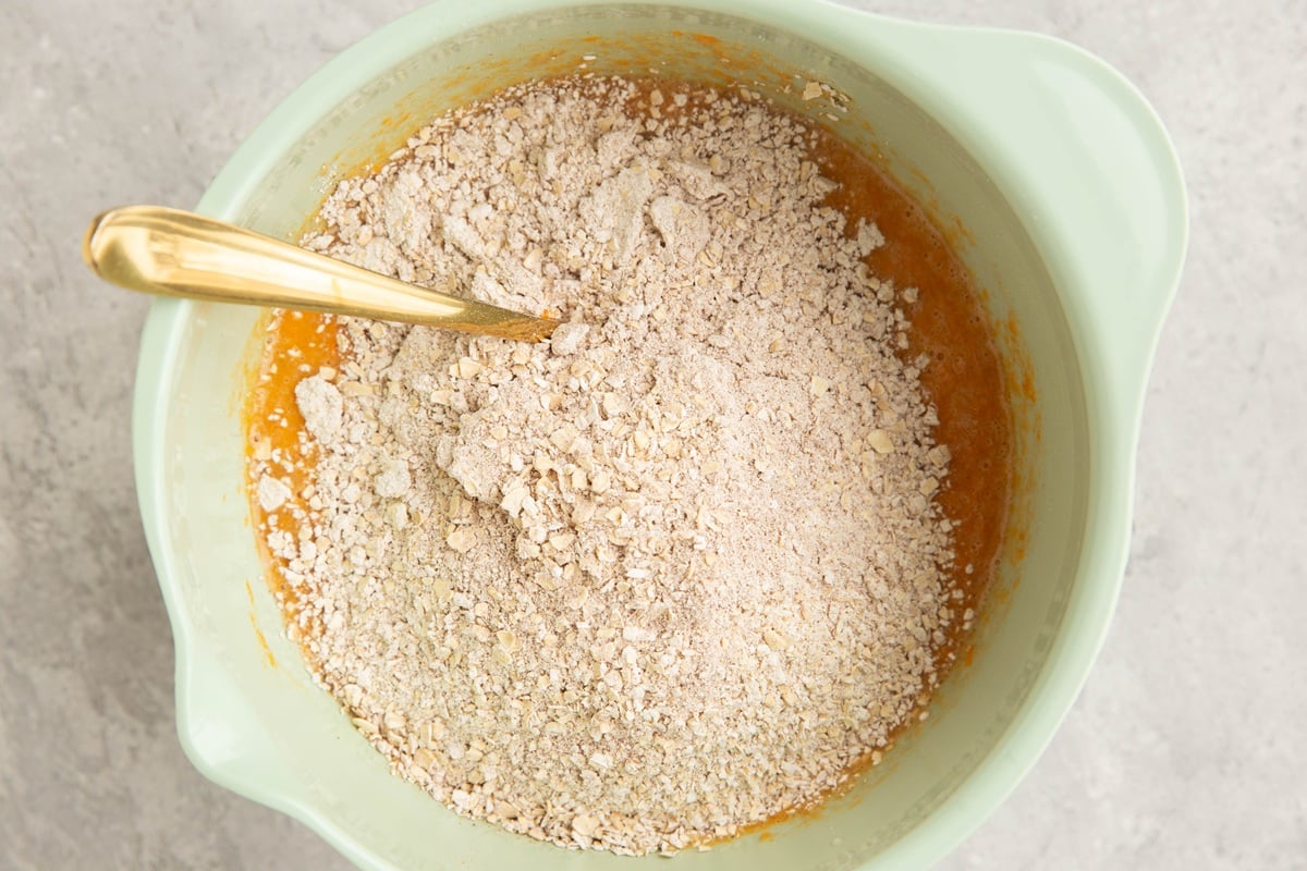 Mixing bowl with wet ingredients on the bottom and dry ingredients on top.