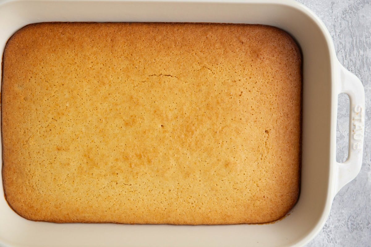 Cake in a 13 by 9 inch cake pan, fresh out of the oven.